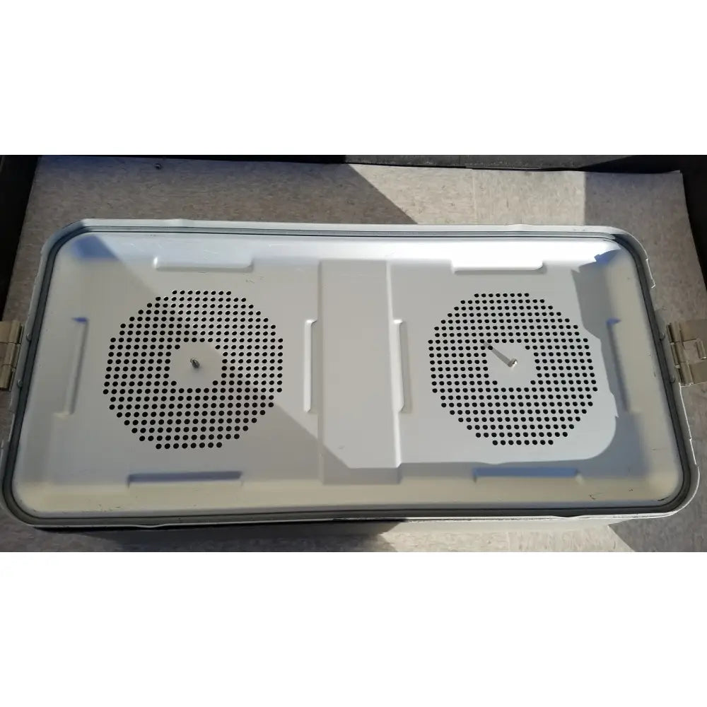 White plastic laptop cooling pad with two circular vents shown alongside medline aluminum storage container