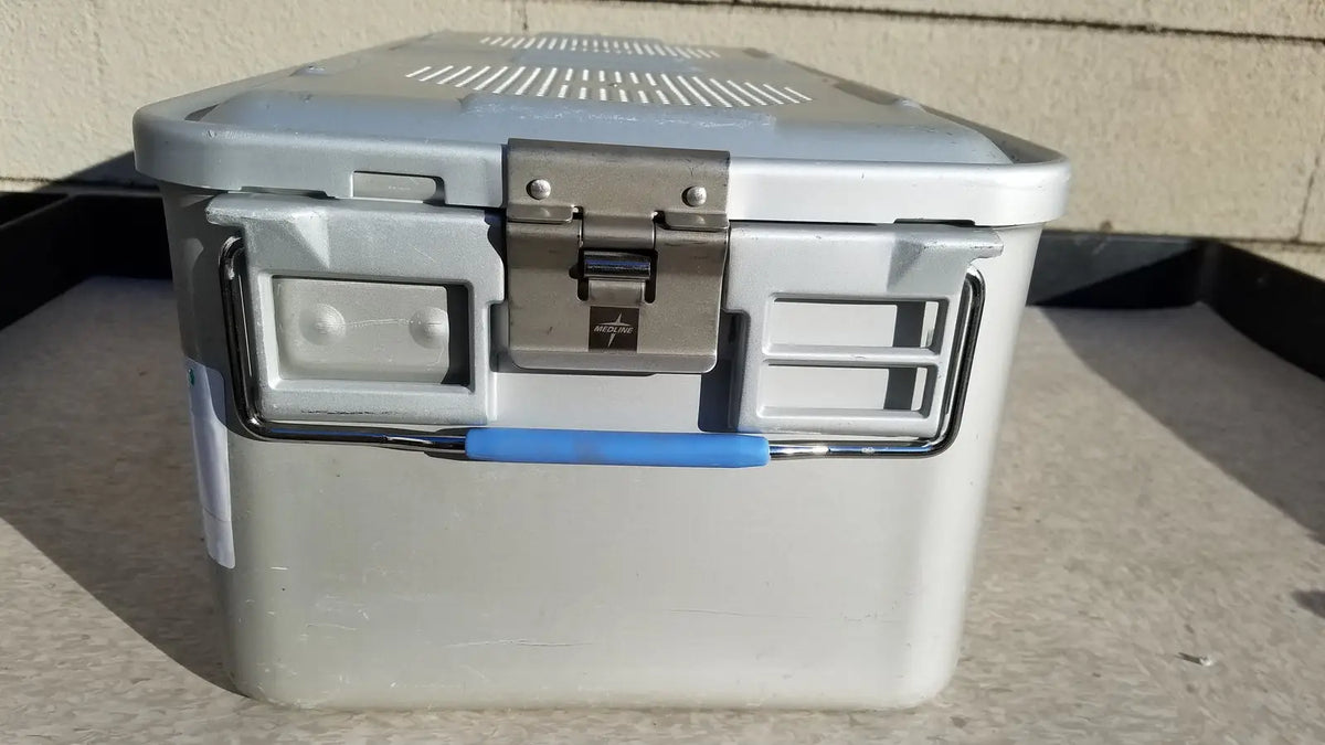 Gray plastic cooler with blue handle and silver metal latch in medline aluminum storage and sterilization container