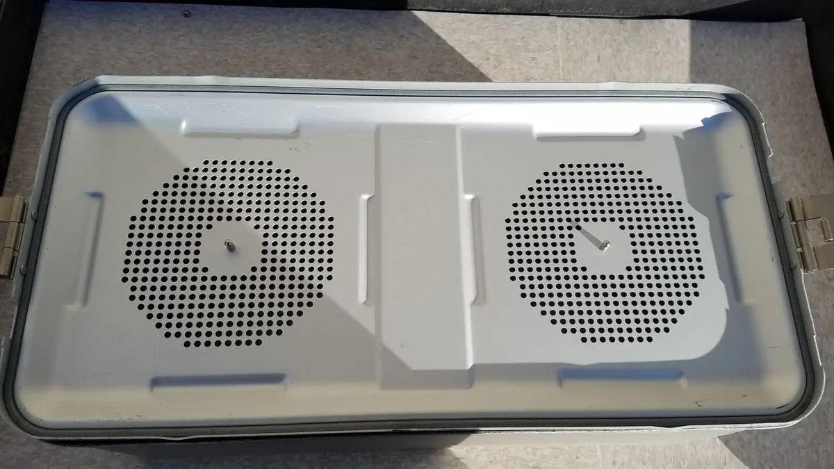 White plastic laptop cooling pad with two circular vents shown alongside medline aluminum storage container