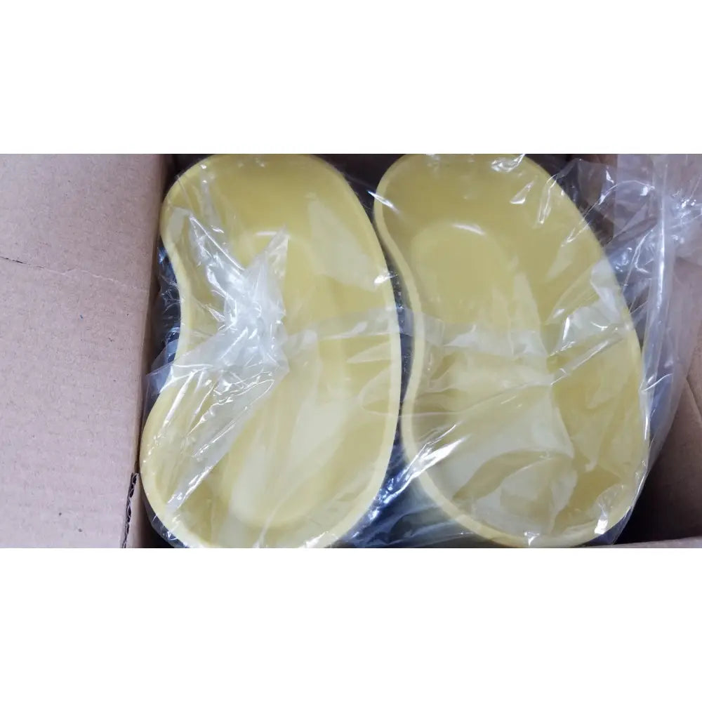 Two pale yellow oval silicone orthotic insoles wrapped in plastic for medline emesis basins gold 500 ml kidney dishes
