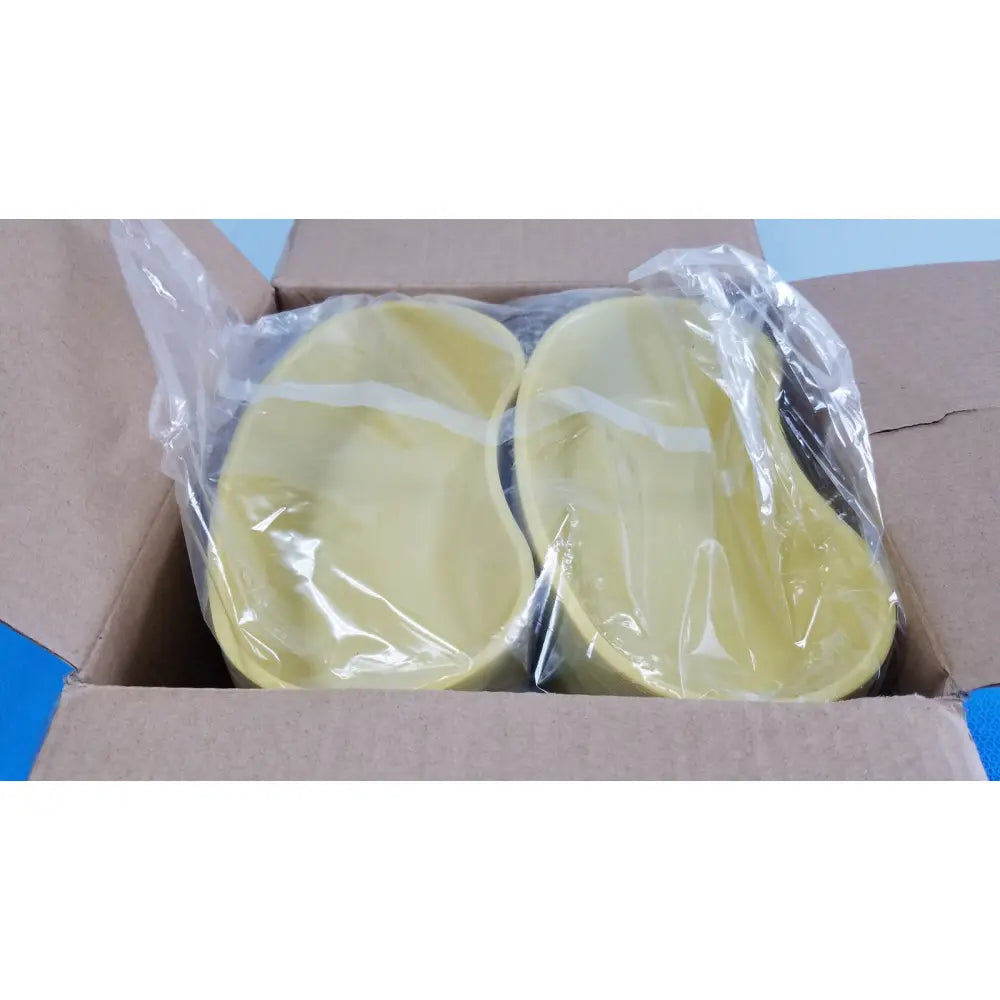 A pair of pale yellow silicone insoles wrapped in plastic inside a box for medline emesis basins gold 500 ml kidney dishes