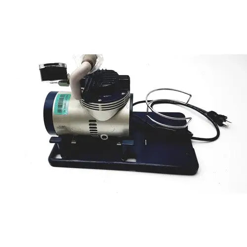 Silver and black medline hcs 7000 vac-assist suction aspirator unit with coiled power cord and sturdy base