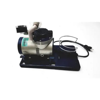 Silver and black medline hcs 7000 vac-assist suction aspirator unit with coiled power cord and sturdy base