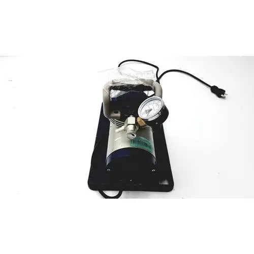 Black and silver medline hcs 7000 vac-assist suction aspirator unit with foot pump pressure gauge power cord and green label