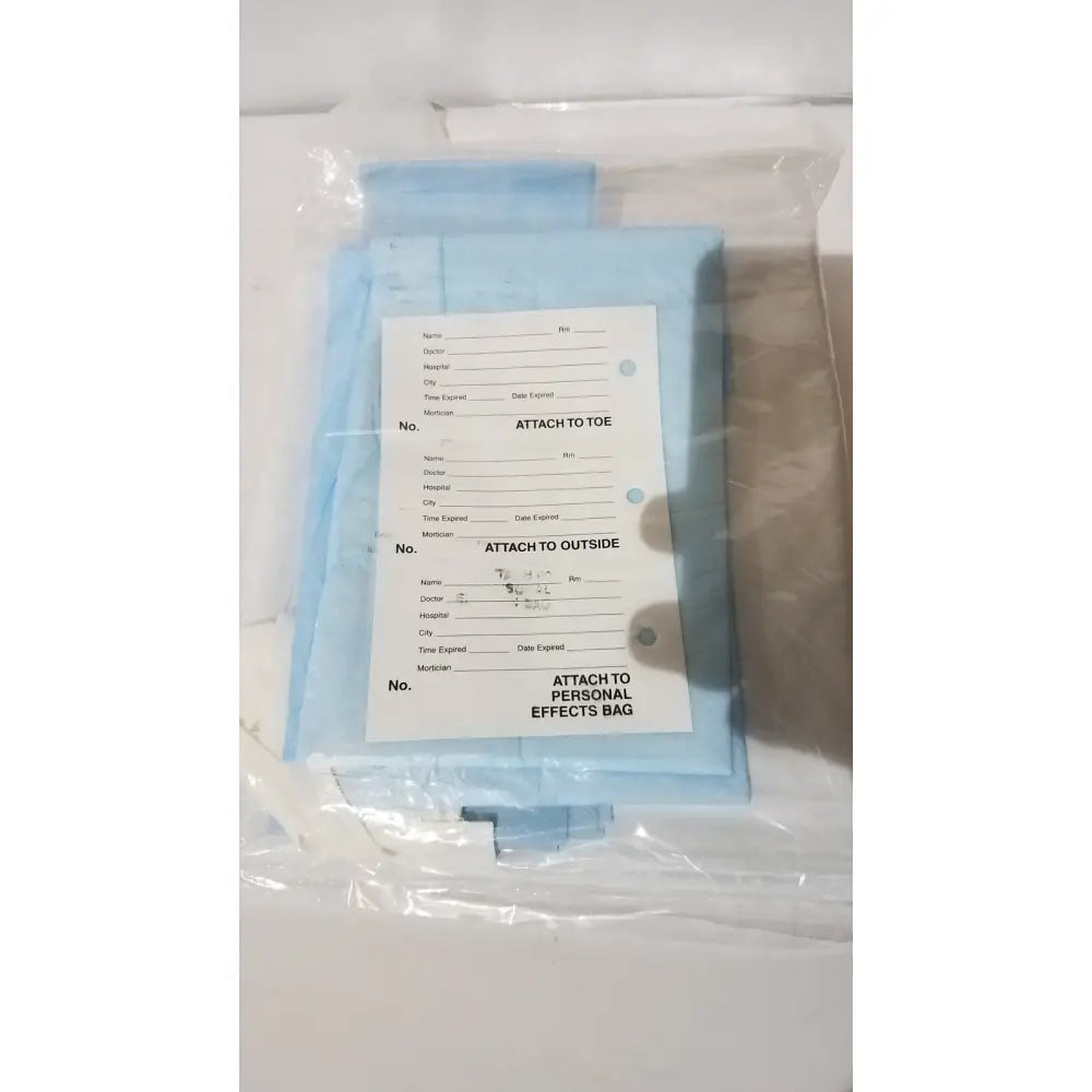 Light blue medical identification tags with patient info fields for attachment on medline post mortem body bag
