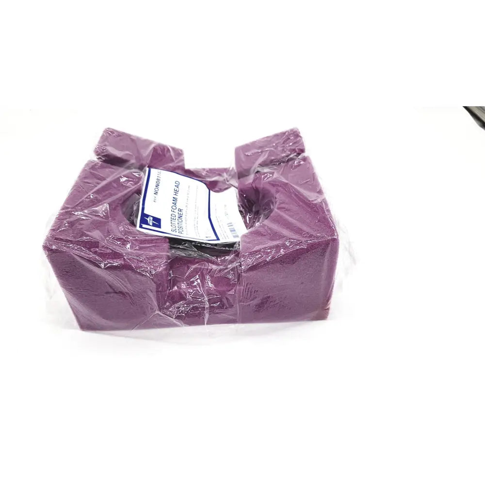 Medline single use slotted foam head positioner in purple molded foam wrapped in clear plastic for support use