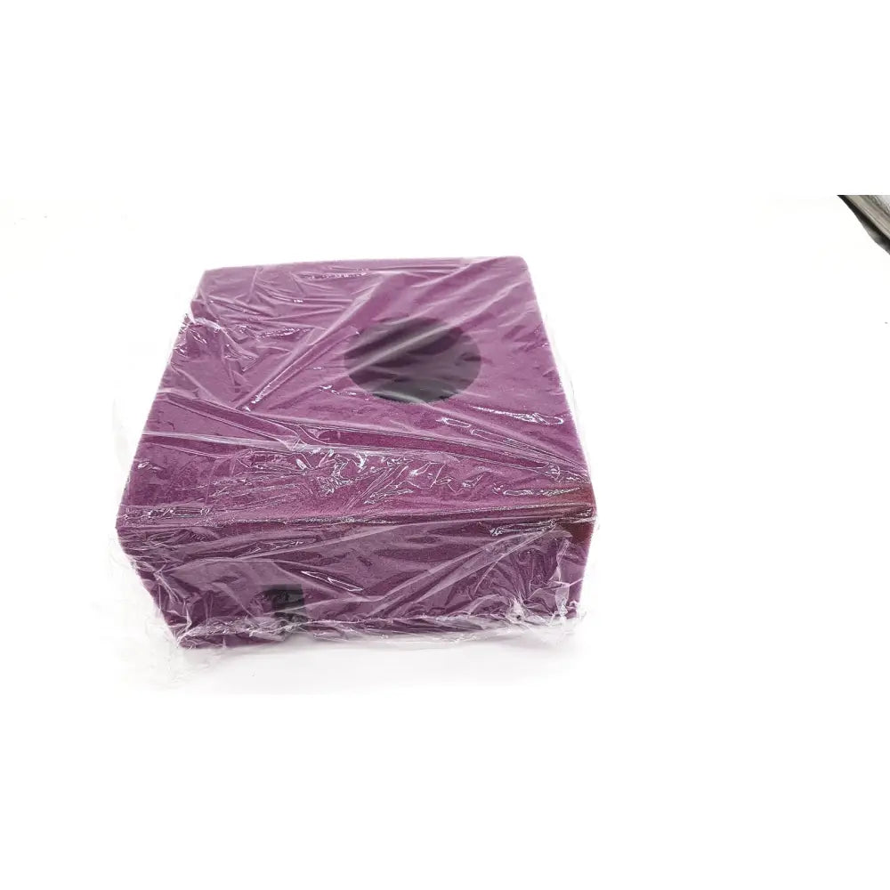Medline single use slotted foam head positioner in a purple rectangular box wrapped in clear plastic with circular cutout on top