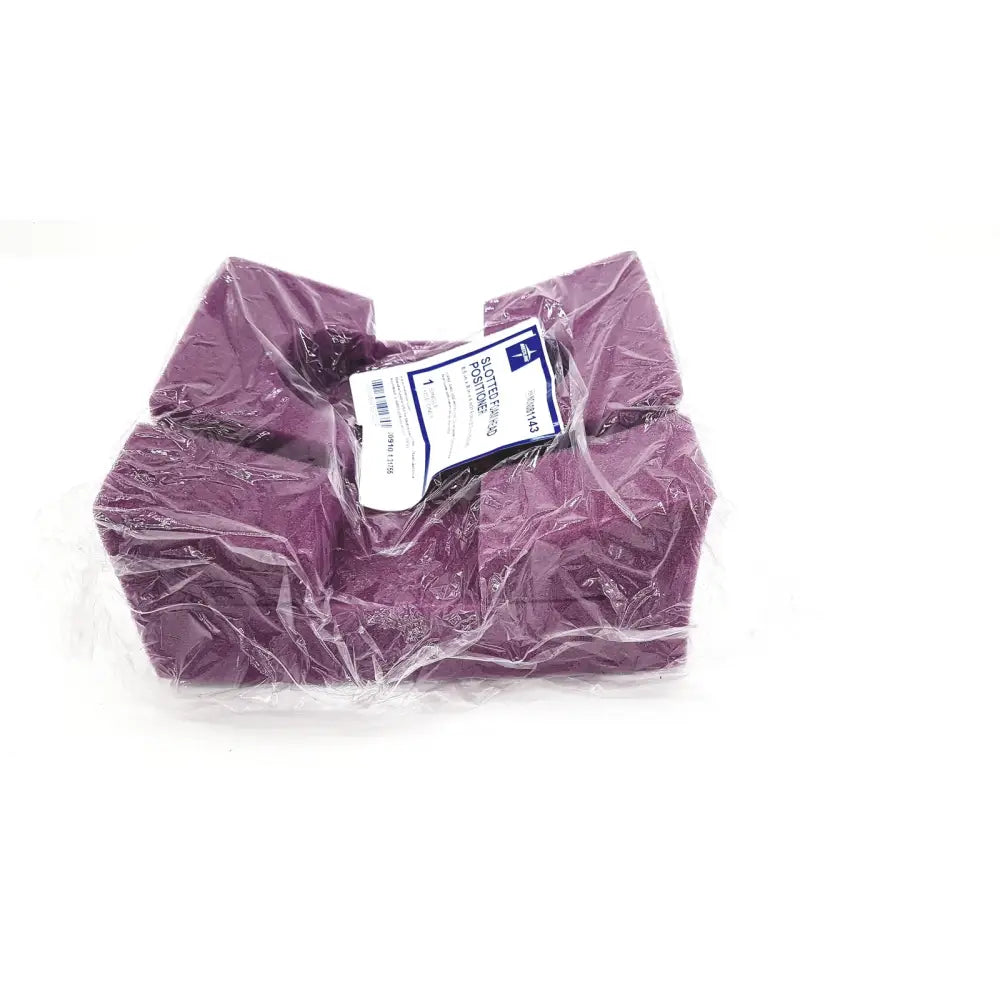 Medline single use slotted foam head positioner with purple plastic lottery tickets wrapped in clear plastic packaging
