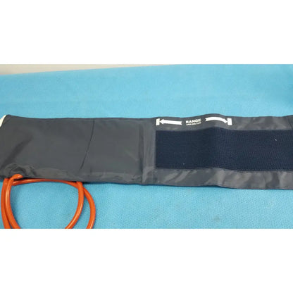 Black fabric medline sphygmomanometer artery large adult blood pressure cuff with orange tubing and white measurement labeling