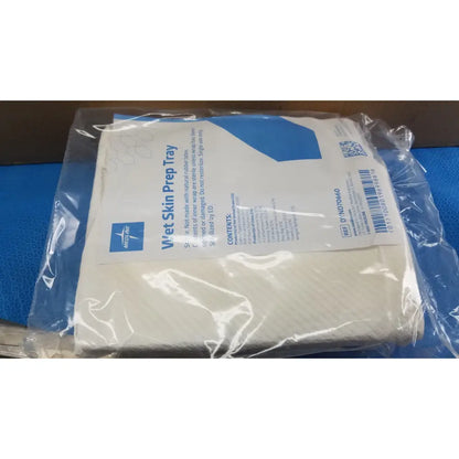Medline wet skin prep tray with white wet skin prep in clear plastic packaging and blue labeling with qr code