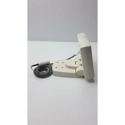 Beige plastic wall-mounted telephone with gray coiled cord and black handset for medrad mark v provis rd injector control panel power console