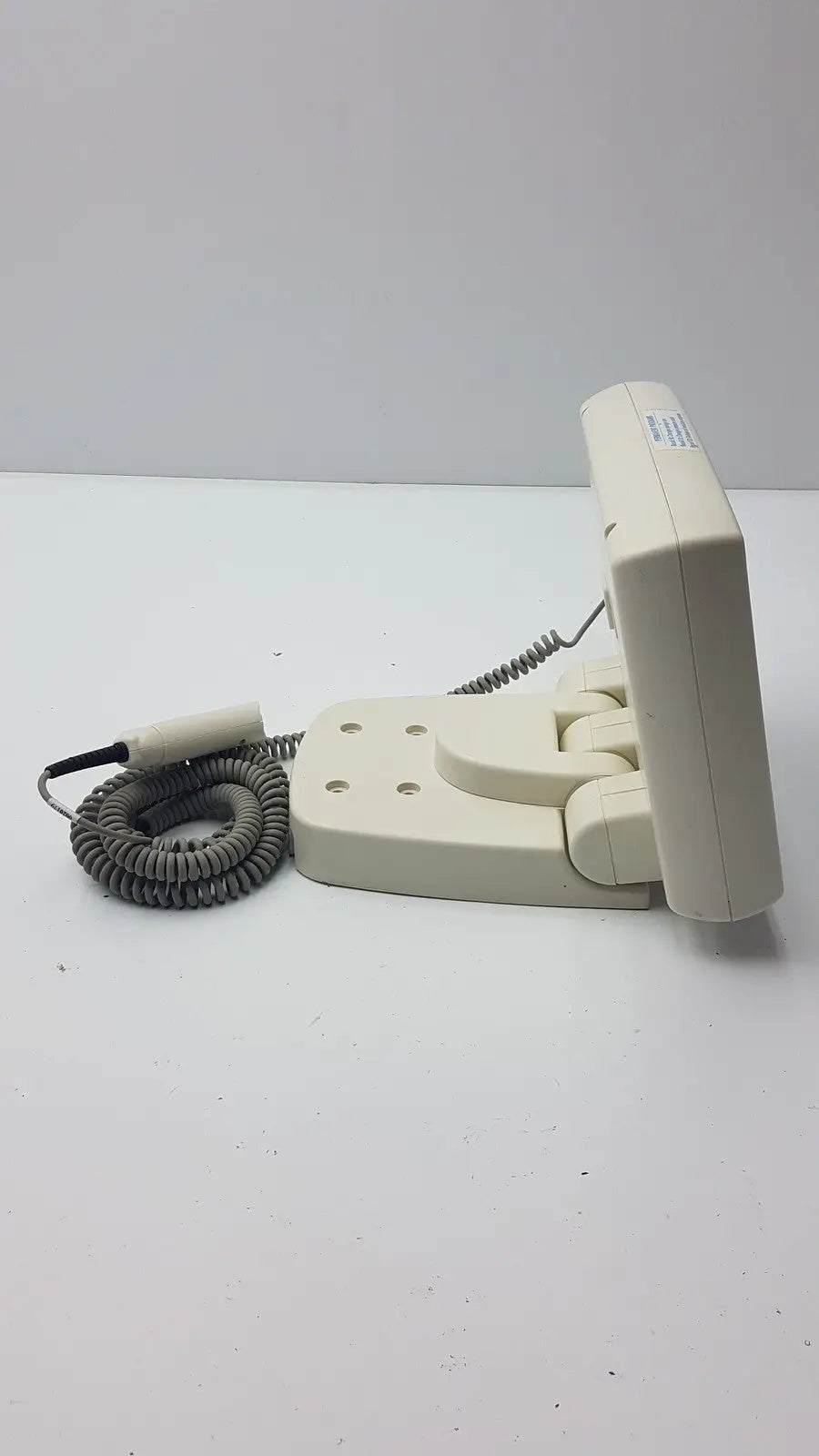 Beige plastic wall-mounted telephone with gray coiled cord and black handset for medrad mark v provis rd injector control panel power console