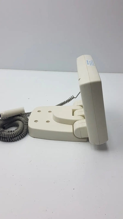 Cream-colored plastic wall-mounted telephone with coiled gray cord on Medrad Mark V ProVis RD injector control panel power console