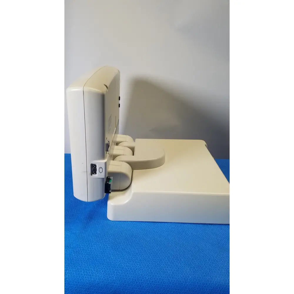 Beige plastic medrad spectris solaris ep mr contrast injector system monitor with rectangular base and curved arm