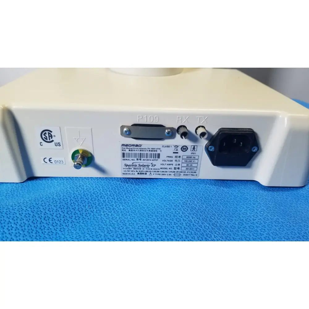 White plastic medrad spectris solaris ep medical device back side with black power plug and multiple ports for mr contrast injection