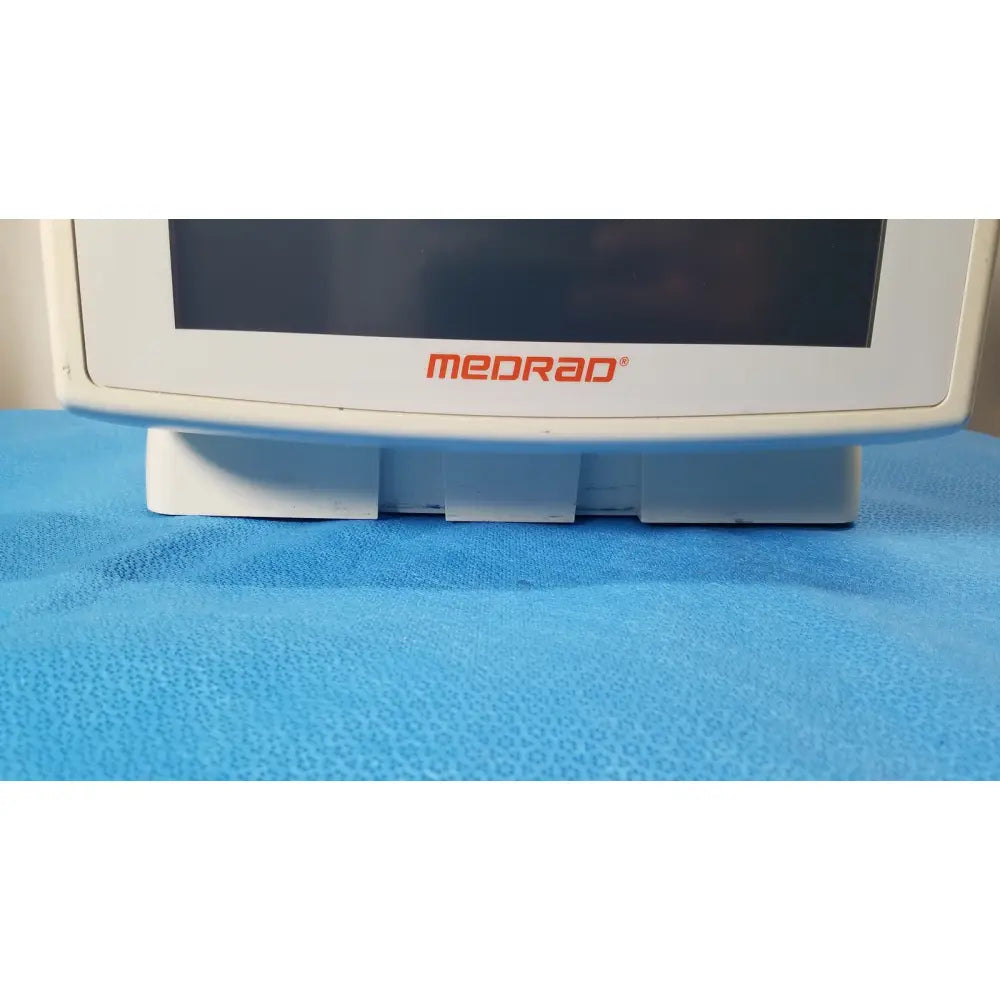 White medrad spectris solaris ep mr contrast injector system monitor with sleek rectangular screen and sturdy base