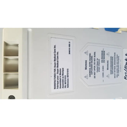 White plastic medrad spectris solaris mr injection system battery with warning labels and manufacturer information