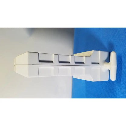 White plastic dental impression tray with rectangular segmented design and rounded edges for medrad spectris solaris mr injection system battery