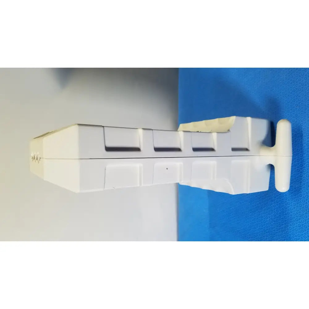 White plastic medrad spectris solaris mr injection system battery with segmented rectangular design and t-shaped handle