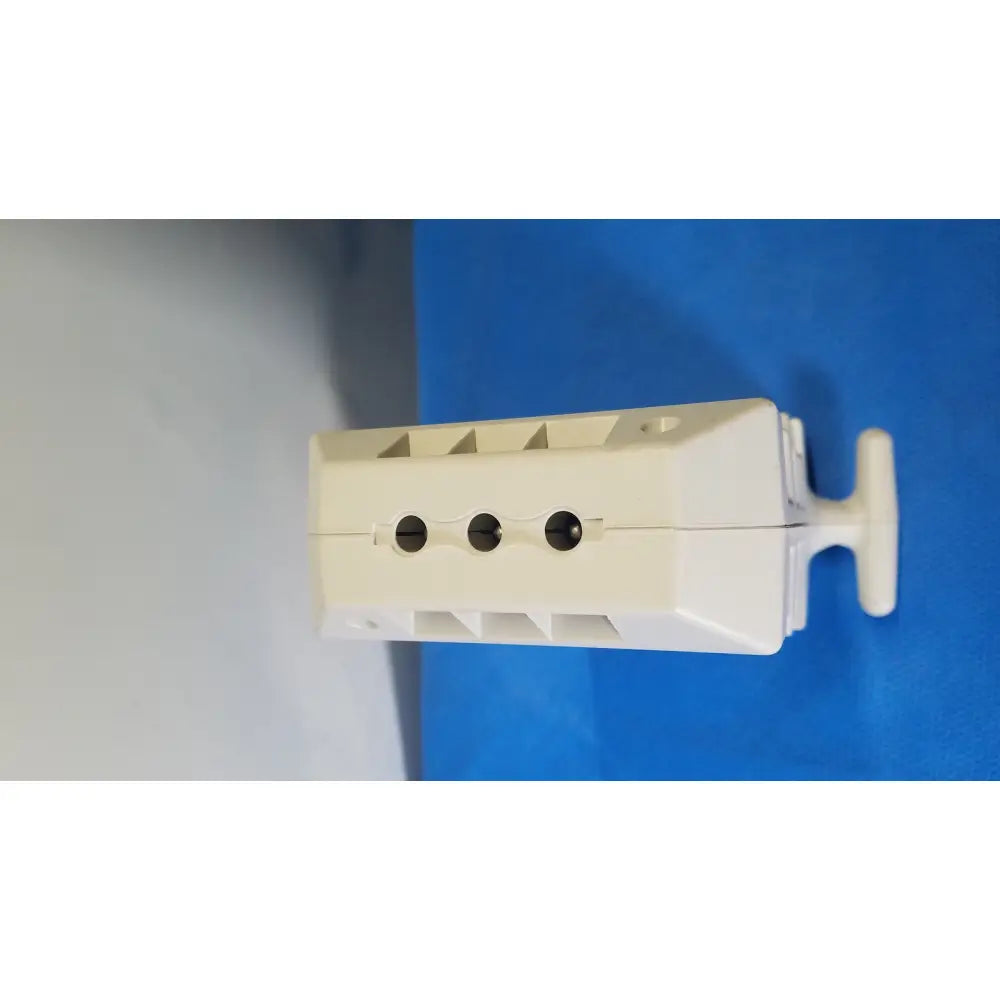 White plastic wall-mounted electrical outlet cover with three circular cutouts for medrad spectris solaris mr injection system battery
