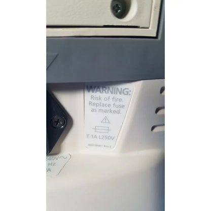 White fuse replacement warning label with black text on the back of medrad veris monitoring system for reuse medical safety