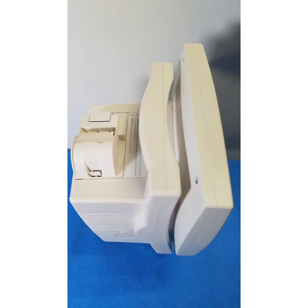 Cream-colored plastic receipt printer with curved top and paper roll compartment for medrad veris monitoring system