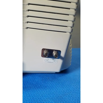 White plastic medrad veris monitoring system device back with two silver coaxial connectors labeled tx and rx for reuse medical use