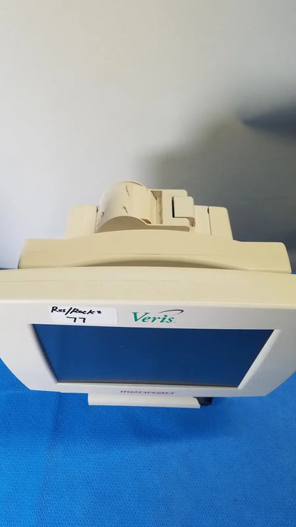 Beige Medrad Veris monitoring system terminal with white bezel and blue screen for advanced medical monitoring