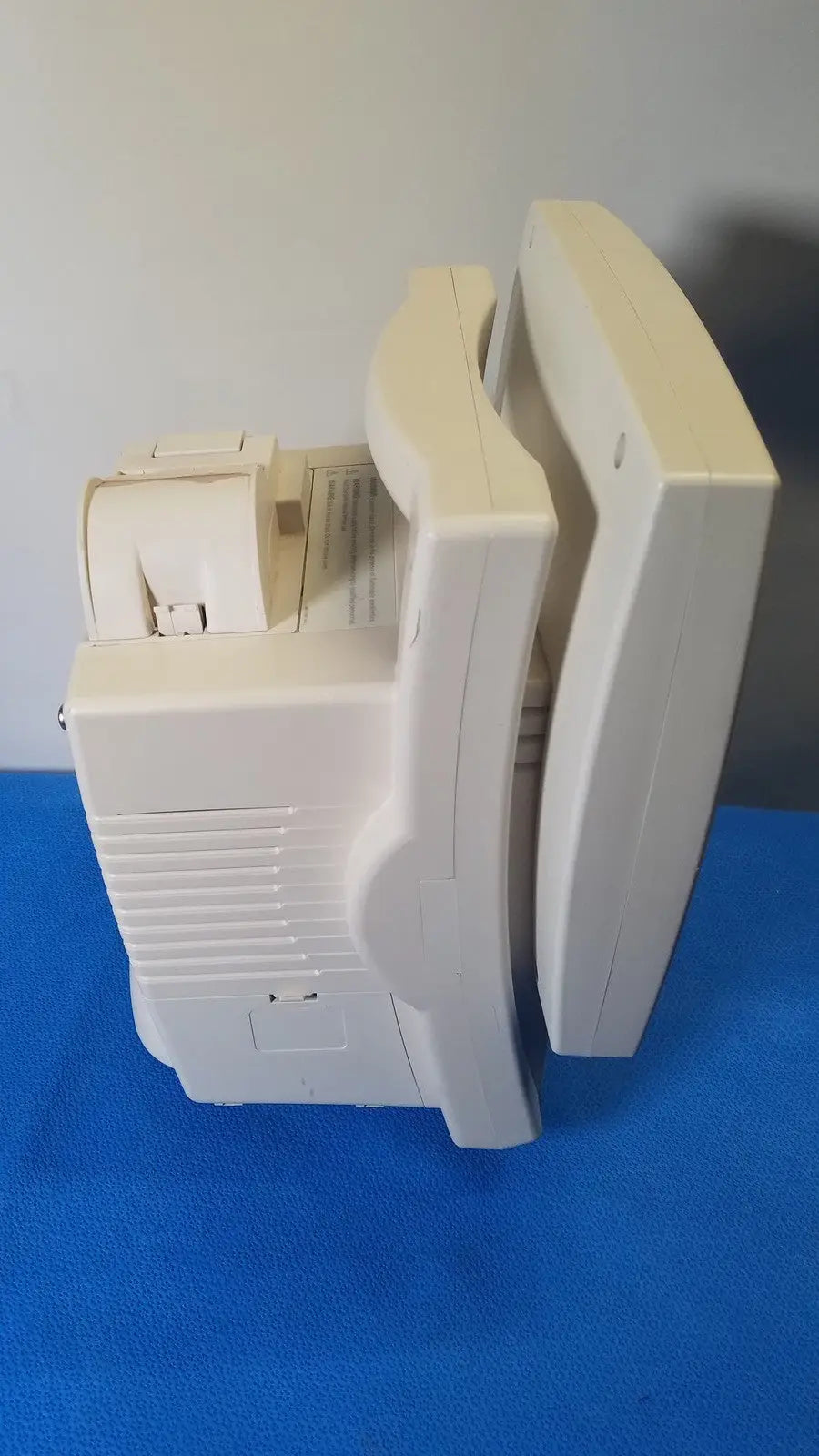 Cream-colored plastic crt monitor with curved screen and side ventilation slats for Medrad Veris monitoring system