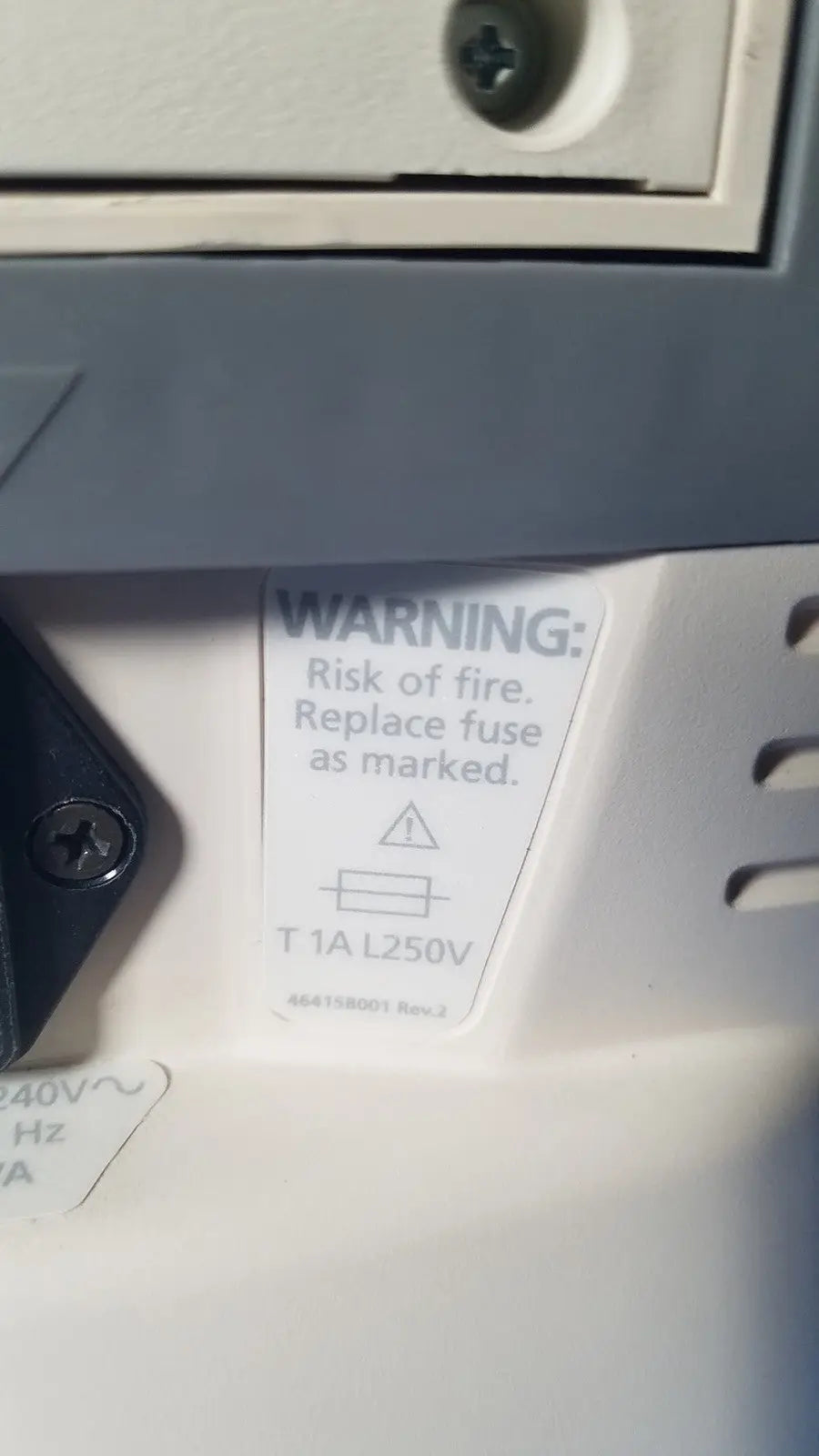 White fuse replacement warning label with black text on the back of medrad veris monitoring system for reuse medical safety