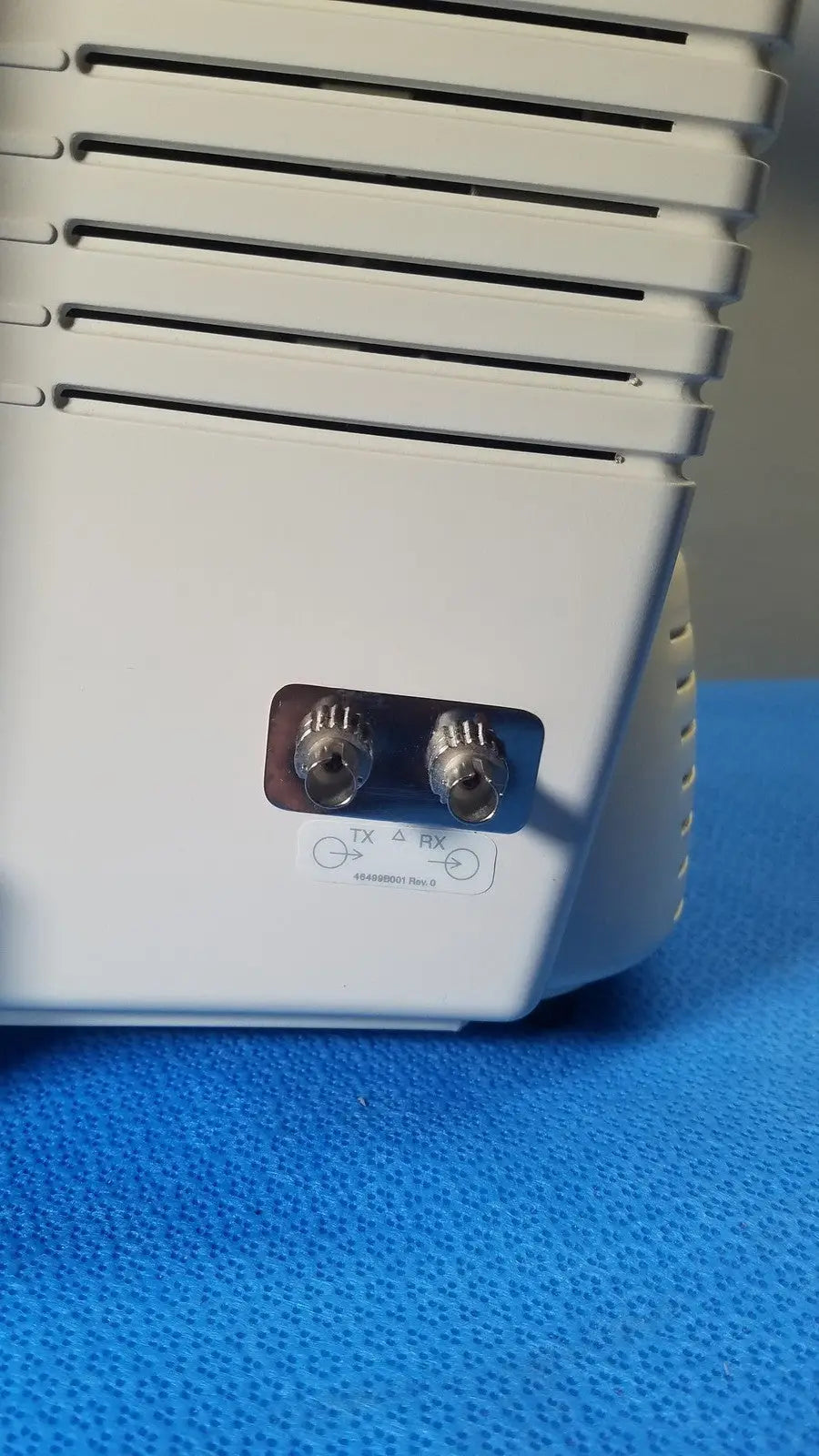 White plastic medrad veris monitoring system device back with two silver coaxial connectors labeled tx and rx for reuse medical use