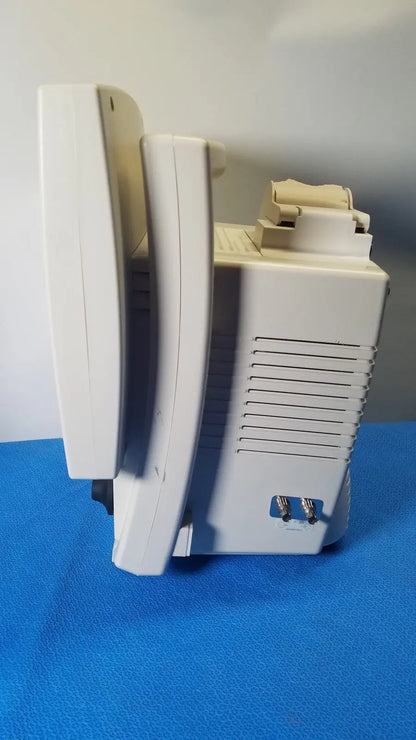 White plastic medrad veris monitoring system with beige control panel and side ventilation slits for reuse medical use