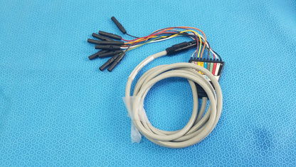 Coiled beige Medtronic 2ACHC catheter ECG cable with multicolored wires and black connectors for medical equipment use