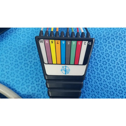 Black plastic ethernet cable tester with color-coded ports and blue logo for medtronic 2achc catheter ecg medical equipment