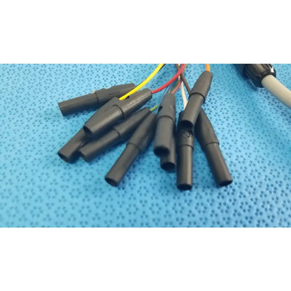 Black plastic electrical connectors with colored wires on the back side of medtronic 2achc catheter ecg cable medical equipment
