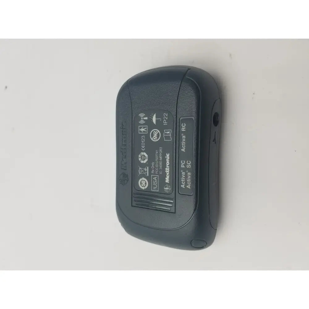 Black plastic metronic activa rc dbs patient programmer with textured surface and embossed branding for reuse medical use