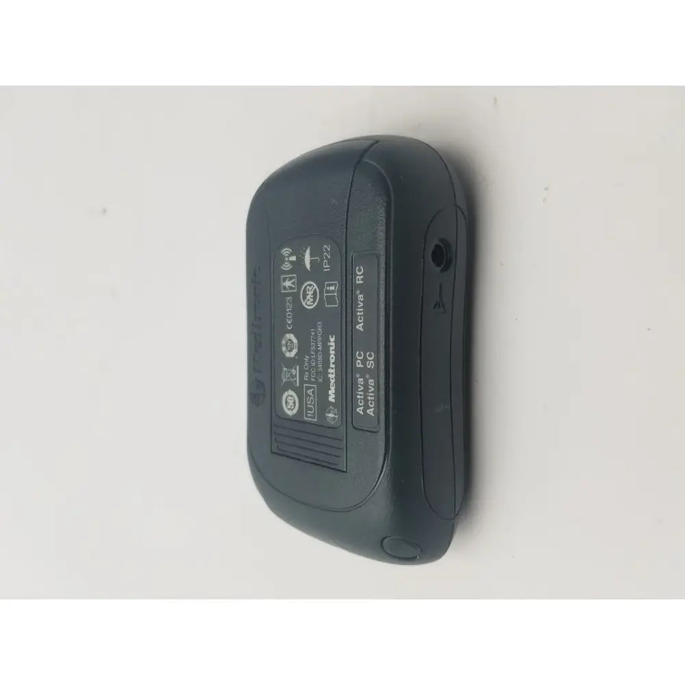 Black medtronic activa rc insulin pump with matte finish and rounded edges for dbs patient programmer reuse medical use