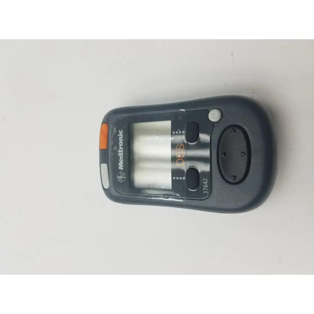 Black medtronic 37642 dbs patient programmer with orange accent button and digital display for dbs patient use