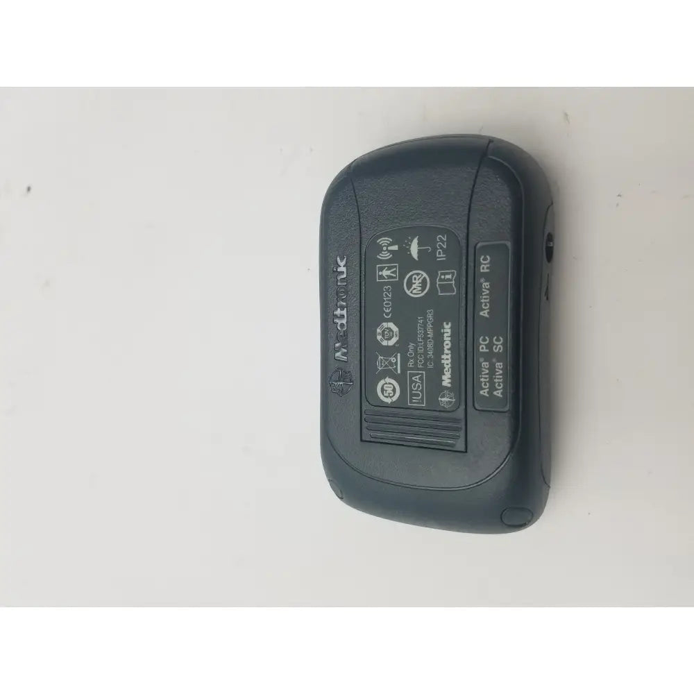 Black medtronic activa rc wireless insulin pump with matte finish and rounded edges for dbs patient programmer reuse medical use