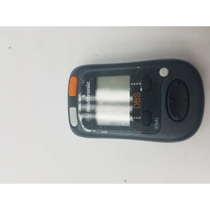 Black mettler-toledo dbs patient programmer with orange and gray buttons digital display and model number 37642 visible