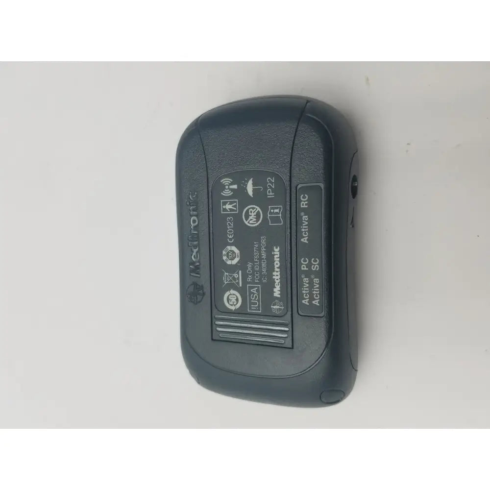 Black medtronic activa pc sc wireless receiver with rounded edges textured surface for dbs patient programmer reuse medical use