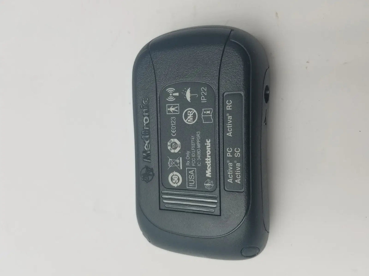 Black medtronic activa pc sc wireless receiver with rounded edges textured surface for dbs patient programmer reuse medical use