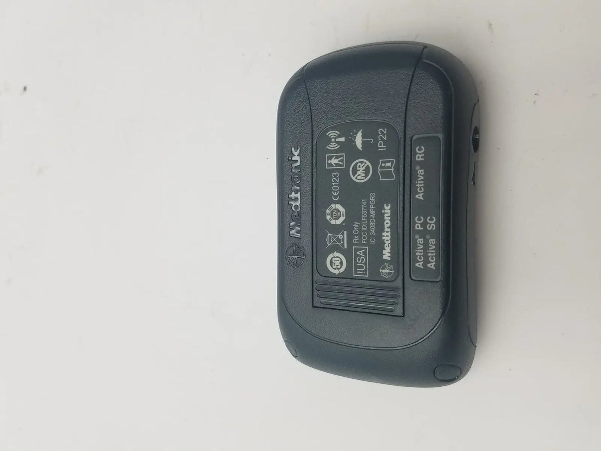 Black medtronic activa rc wireless insulin pump with matte finish and rounded edges for dbs patient programmer reuse medical use