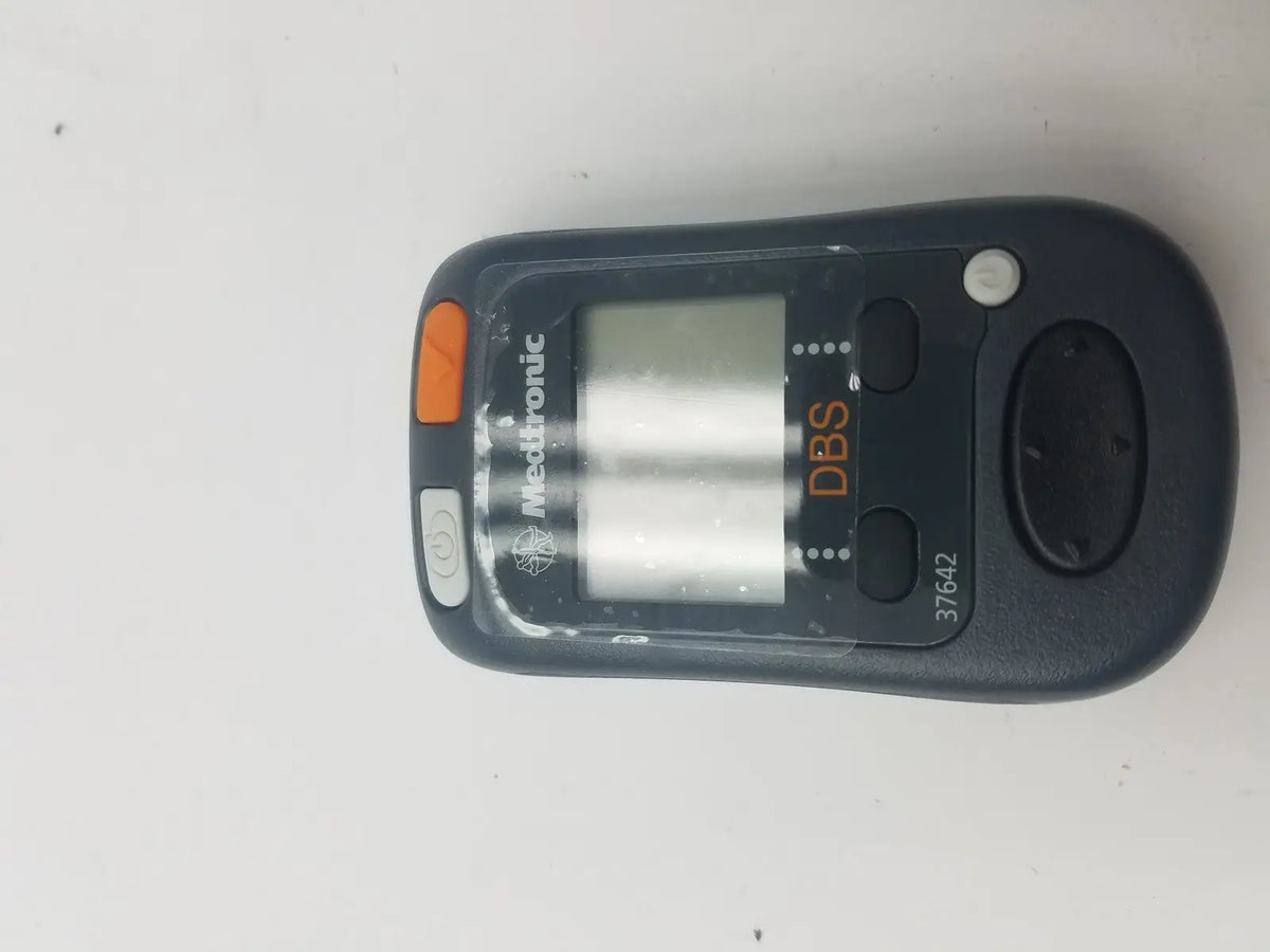 Black mettler-toledo dbs patient programmer with orange and gray buttons digital display and model number 37642 visible