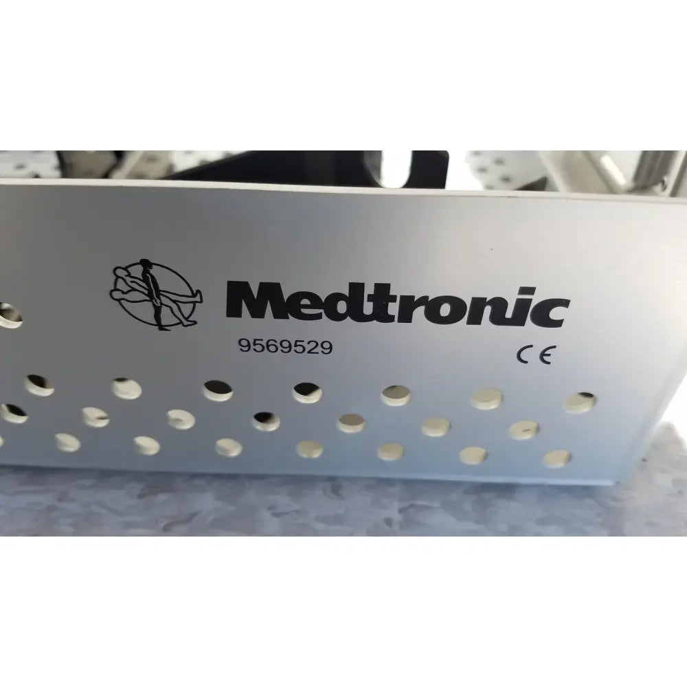 Silver perforated metal dilators tray with Medtronic branding model 9569529 for reuse medical sterilization trays