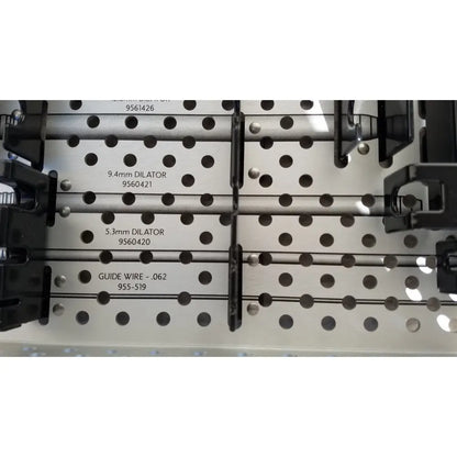 Metallic rigid dilators and guide wires organized in a black holder perforated reuse medical sterilization tray medtronic 9568529