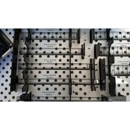 Silver-colored metal rigid dilators with black handles labeled by size in medtronic 9568529 metrx ii dilators tray for reuse medical sterilization trays