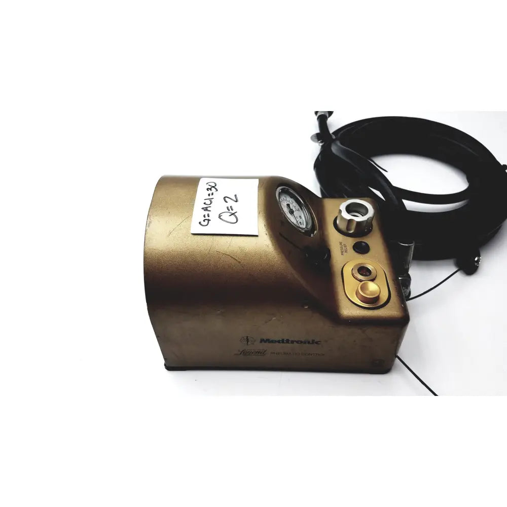 Gold-colored metallic medtronic midas rex legend gold pneumatic drill foot control unit with pressure gauge and control knobs