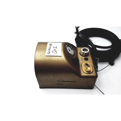 Gold-colored metallic medtronic midas rex legend gold pneumatic drill foot control unit with pressure gauge and control knobs
