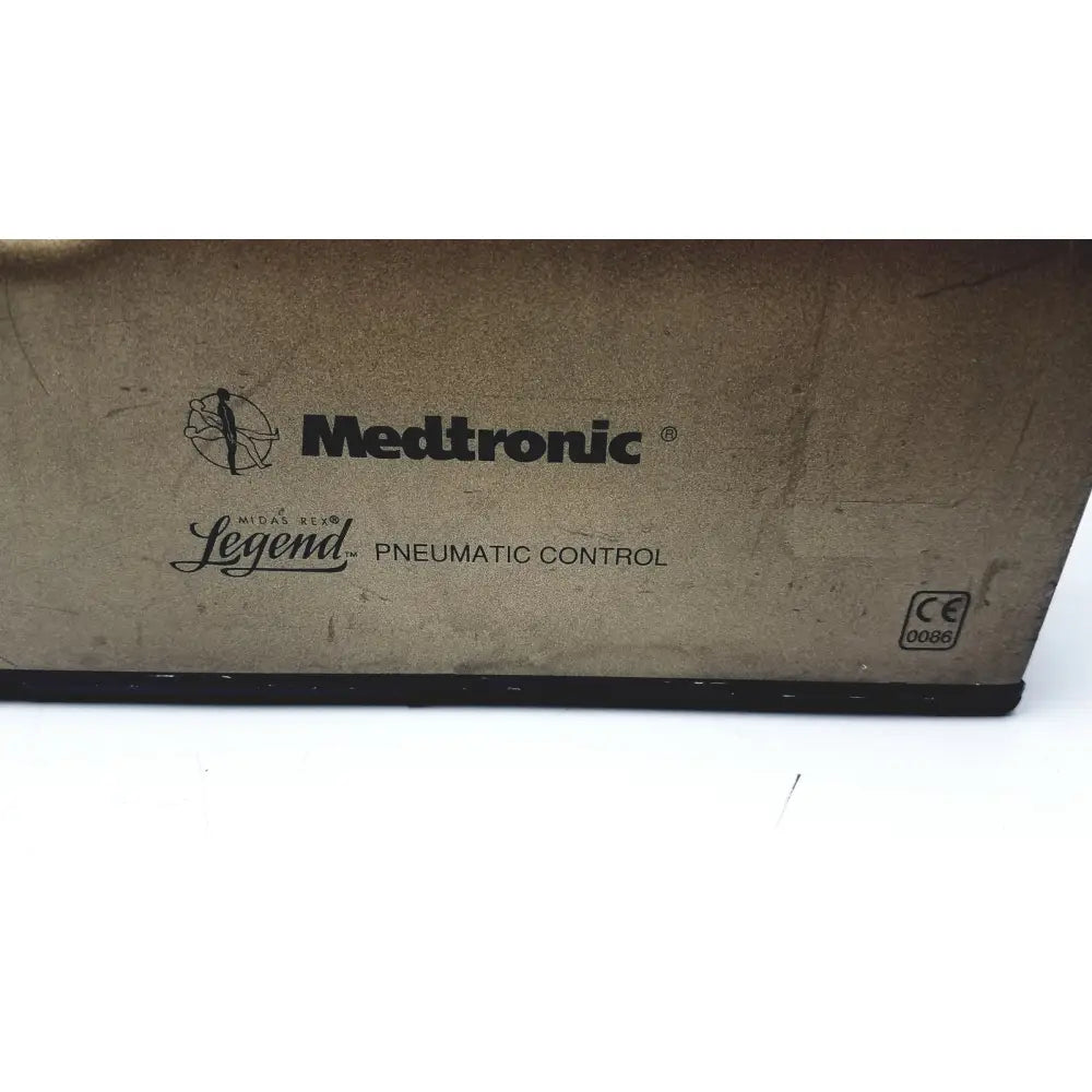 Medtronic a65535-07 midas rex legend gold pneumatic drill foot control unit box with brown cardboard surface and black branding